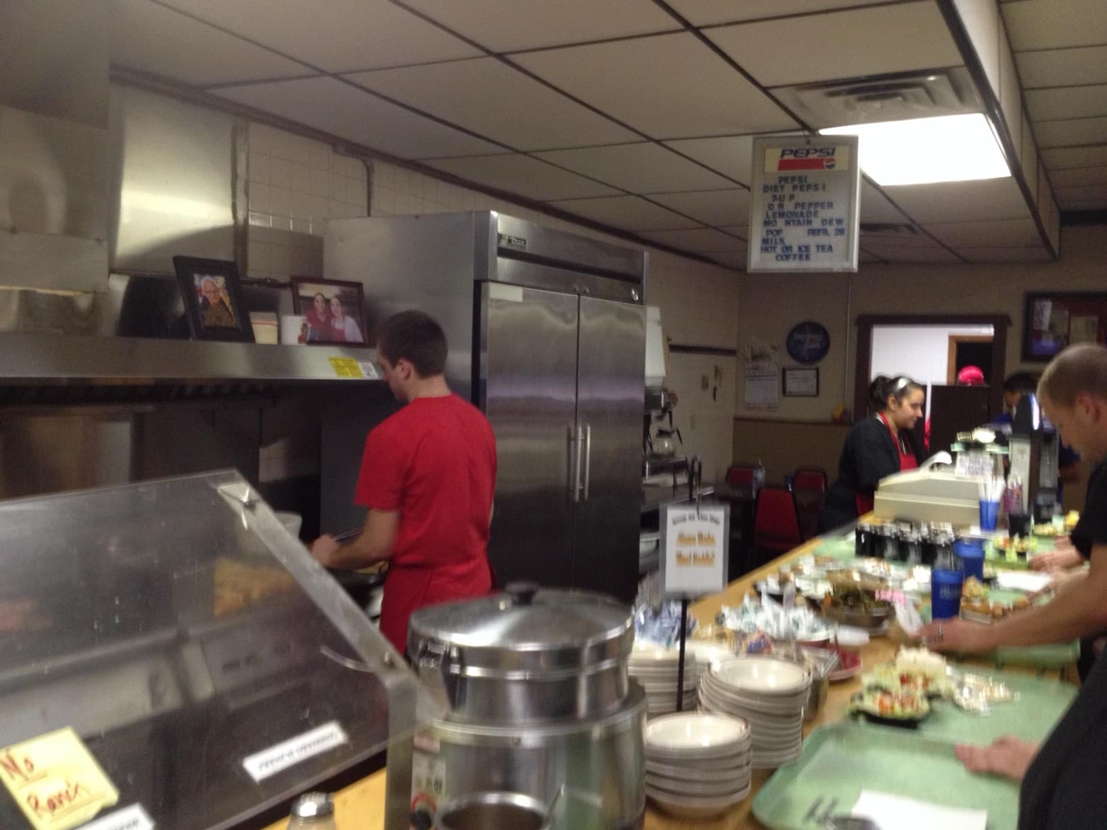 Staff working behind the counter of Farmington Steak House